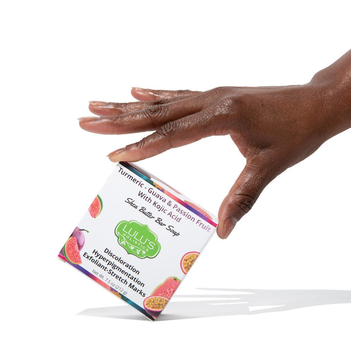 A luxurious bar of Lulu's Holistics Guava Passionfruit soap featuring potent kojic dipalmitate and turmeric root. Formulated to visibly fade hyperpigmentation, brighten dark spots, and reveal an even skin tone naturally with nourishing shea butter.