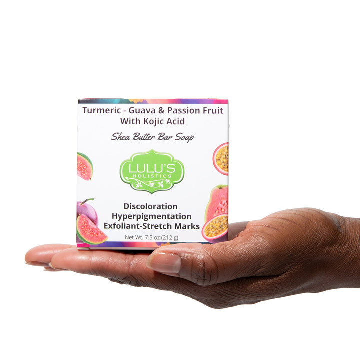 A vibrant bar of Lulu's Holistics Guava Passionfruit Turmeric and Kojic Dipalmitate soap, crafted with nourishing shea butter to gently cleanse melanin-rich skin and reveal a natural, radiant glow.