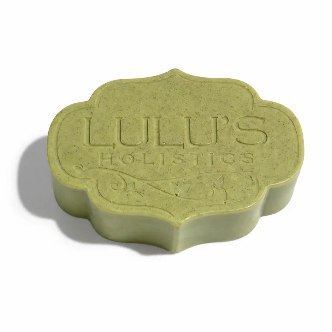 Custom ornate embossed green Lulu's Holistics Pear and Moringa Mango Butter Bar Soap on a crisp white background
