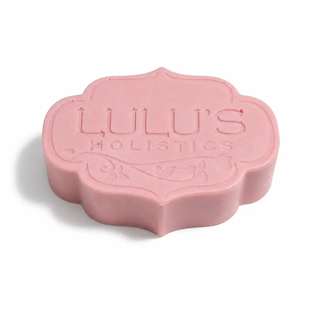 Custom ornate embossed pink Lulu's Holistics Strawberry Dragon Fruit Raspberry botanical bar soap on a crisp white background