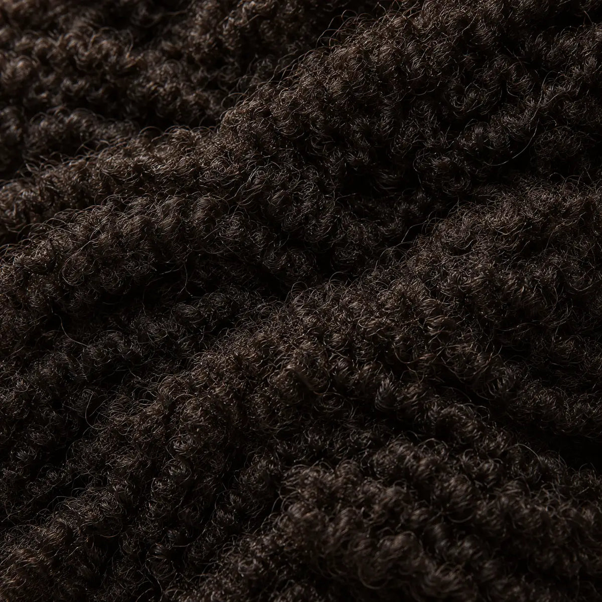 Close-up of healthy, dense, tightly coiled natural hair nourished by Lulu's Holistics Vital products.