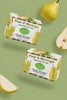 Professional marketing video featuring two floating boxes of Lulu's Holistics Pear and Moringa Mango Butter Bar Soap with falling organic pear slices on a muted olive green background